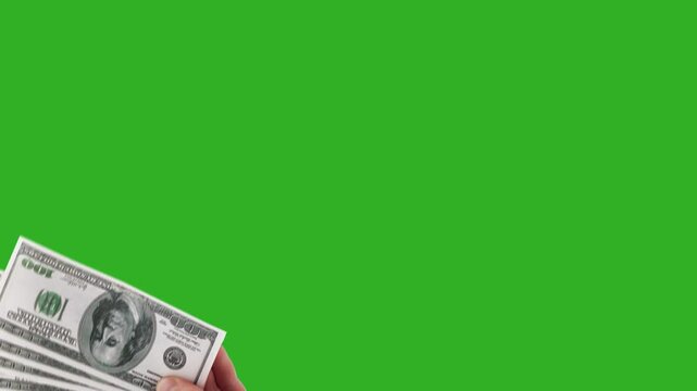 A hand with dollars fan-shaped appears on the chromakey background. 4K
