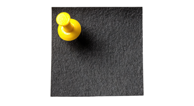 Yellow Pushpin on Dark Slate Background