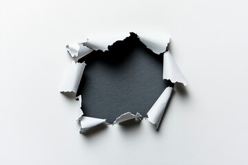 Torn white paper with black hole background