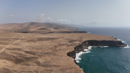 sunset from the ocean overlooking the desert area