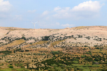 Wind turbine on the hill on island Pag, Croatia.