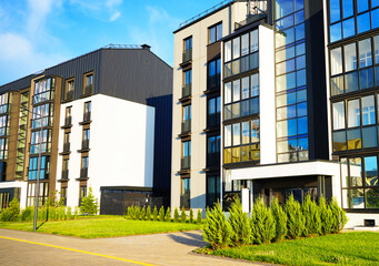 Modern apartment house block. Facade of New modern residential Condo house complex. City apartment building. Condominium building in Cityscape. Modern European residential building apartments.
