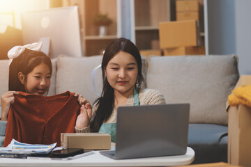 Young asian women happy after new order from customer. Surprise and shock face of asian woman success on making big sale of his online store. Online Selling. Online Shopping