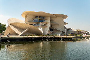 National museum of Qatar in Doha against the background of the blue sky.