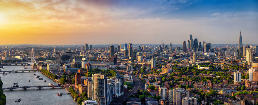 Panoramic landscape view of the London skyline seen from Nine Elms stretching from the City to Westminster during summer sunset time
