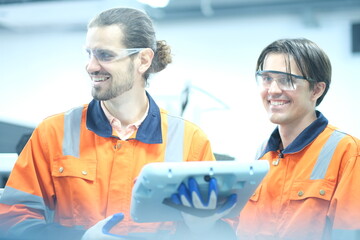 Electrical engineer testing artificial intelligence robot arm at high technology research...
