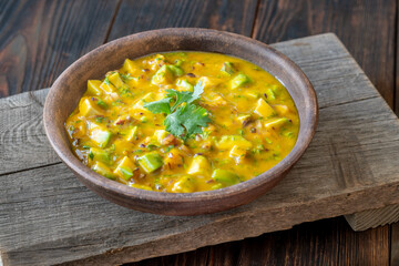 Rustic bowl of mango salsa bursting with color and fresh tropical flavor
