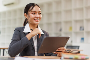 Business woman signs an electronic document on a digital document on a virtual tablet laptop...