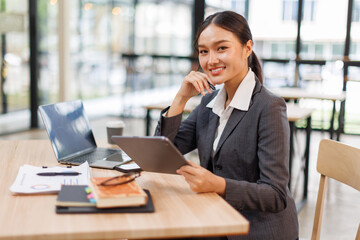 Business woman signs an electronic document on a digital document on a virtual tablet laptop...