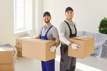 Delivery service for transporting men carrying cardboard boxes, movers service unloading and...