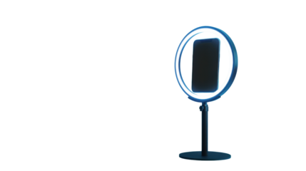 Smartphone mounted in a ring light on a stand for video recording and live streaming content creation setup with modern lighting equipment isolated on white background
