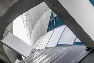 Fototapeta premium Futuristic urban architecture with geometric steel and glass elements