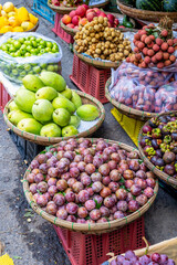 Vibrant tropical fruit market display with baskets of fresh produce