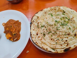 Indian Garlic Naan with paneer gravy