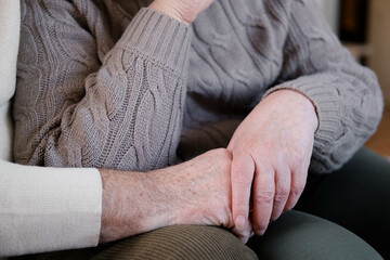 Senior Couple holding hands. Elderly Man and Woman. Two loving old hands being held together....