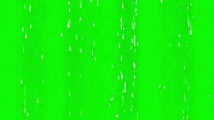 Rain falling on a green screen background for visual effects compositing and weather simulation