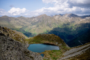 Scenic mountain lake nestled in remote valley in the Austrian Alps