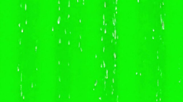 Rain falling on a green screen background for visual effects compositing and weather simulation