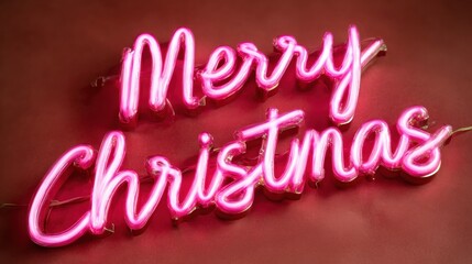Neon pink "Merry Christmas" sign glowing against a red background, creating a festive and cheerful holiday atmosphere.