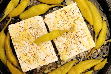 Baked feta cheese with pepperoni and onions	
