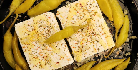 Baked feta cheese with pepperoni and onions	