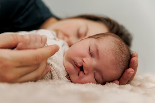Mother and Newborn Sleeping Peacefully
