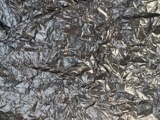 crumpled black plastic bag texture and background