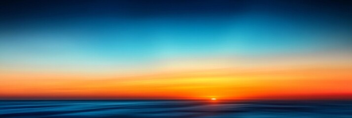 Obraz premium Stunning Sunset Over Tranquil Waters, Capturing a Beautiful Blend of Blue and Golden Hues in the Sky
