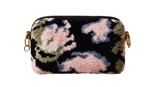 A handcrafted velvet makeup pouch, white background --ar 16:9