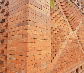 embossed and textured red brick wall arrangement
