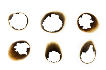 Set of burnt holes in paper with charred edges, Damaged parchment effect for design, texture overlays, or graphic elements.