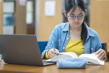 Girls researching in the college library