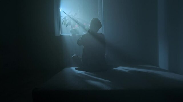 Man praying and asking God for help at night