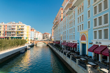Little Venice. Beautiful Venetian-style houses and water channels between the houses and bridges over the river. modern European architecture. Qatar. Doha Qanat Quartier