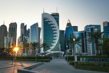 Obraz premium Tall modern skyscrapers tower over central park in Doha Qatar. beautiful panorama of the city.