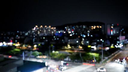 Fototapeta premium City traffic and car lights with bokeh at night in urban skyline