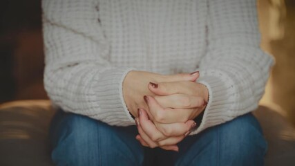 close-up hands person is nervous under stress fidget and pray, sad woman in dark room depression emotion. lonely old age lady feels bad mental health. coping with grief stress misfortune panic attack