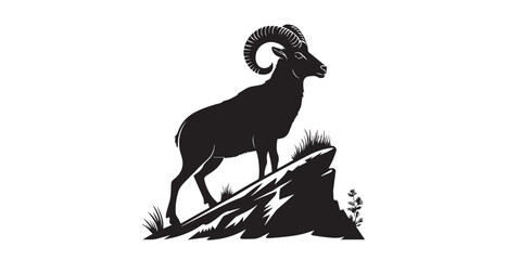 Majestic bighorn sheep standing proudly on a rocky outcrop silhouette