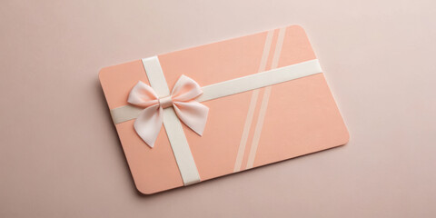 Elegant gift card with a bow on a soft background.