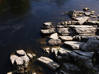 View of the river in england with old roman bridge