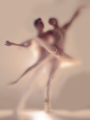 Atmospheric faded ballet composition showcasing male and female dancer poised in mid performance,...