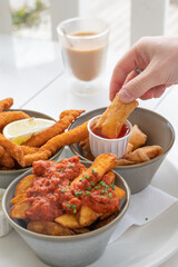 Indulge in Delicious Comfort Food Perfect for Sharing, complete with Tasty Dipping Sauces and Snacks
