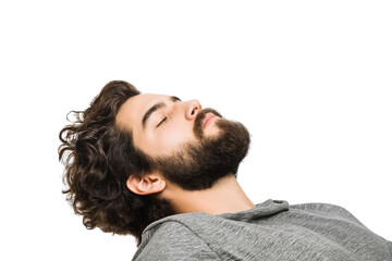 Obraz premium man with curly hair and beard lying down with his eyes closed isolated on white background