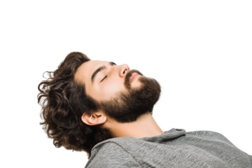 man with curly hair and beard lying down with his eyes closed isolated on white background