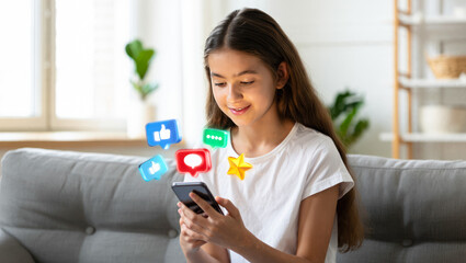 Girl using social media, holding smart phone with icons of like, comment, star over it. schoolgirl playing on smart phone. children's cybersecurity, social media addiction, communication