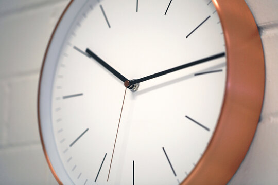 Close up shot of a round wall clock