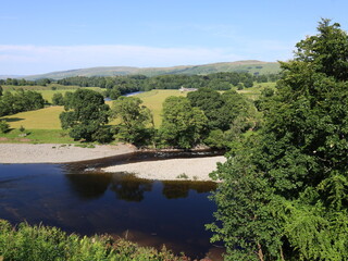 Fototapeta premium View of the river in england with old roman bridge