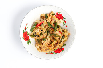 Spicy mushroom stir-fry with tofu and water spinach served in a plate