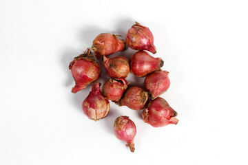 pile of red onions isolated on white background.concept of kitchen spices