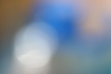 Abstract blur with soft blue and orange tones in bokeh style